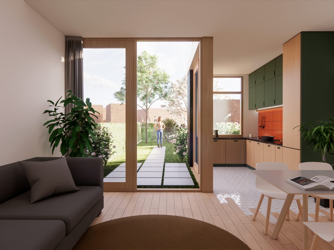 Woonkamer met eettafel en open glazen pui naar de tuin in verbouwde benedenwoning