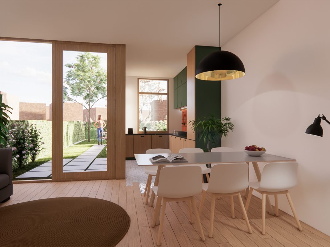 Lichte eetkamer met glazen achtergevel en zicht op de tuin