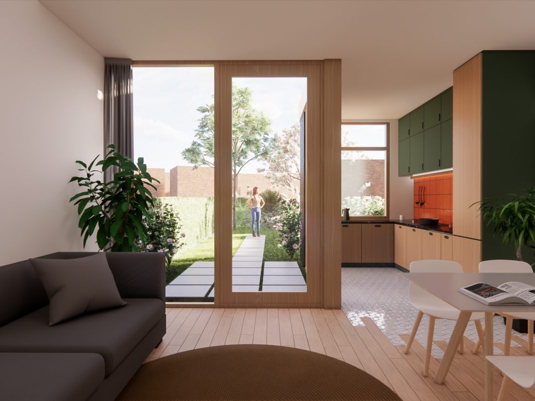 Woonkamer en keuken in één open ruimte met uitzicht op de tuin